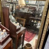 Large antique gilt mirror with scroll and shell decoration, 144 cm