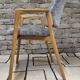 Vintage armchair from the 60s/70s in wood and grey fabric – with armrests.