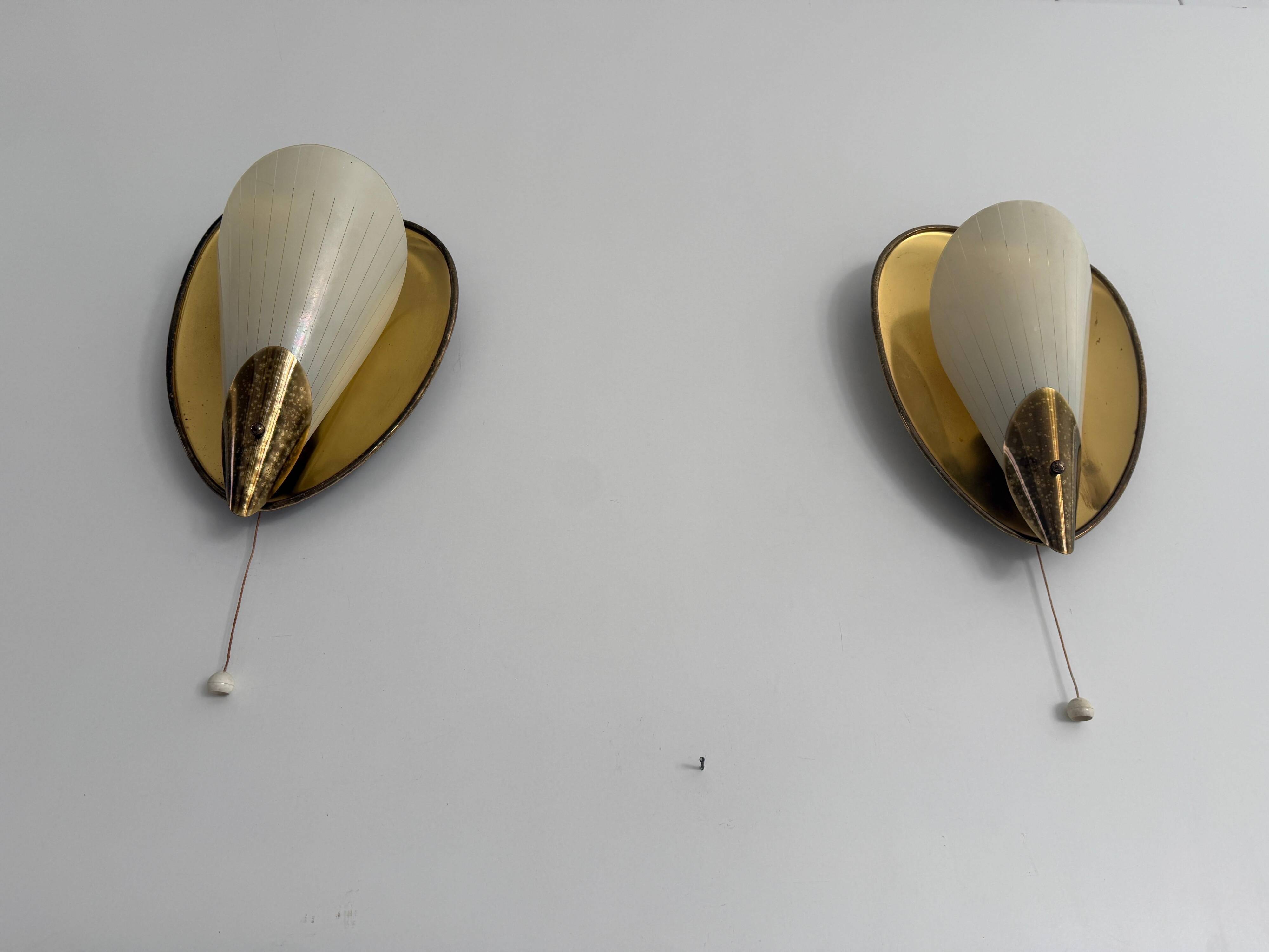 Pair of brass and glass wall lights from the mid-century, 1950s, Germany.