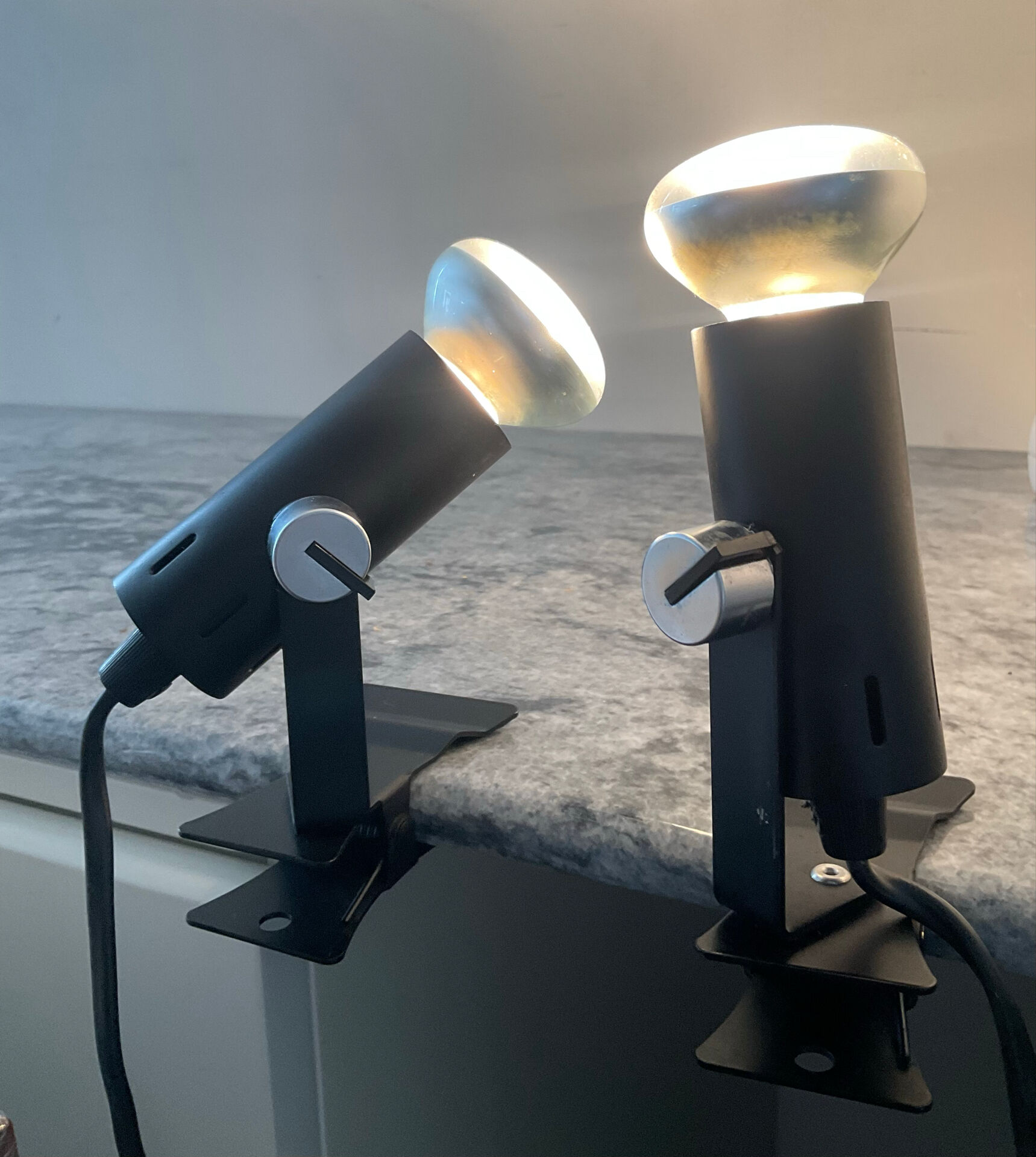 A pair of clamp lamps from the 1970s.