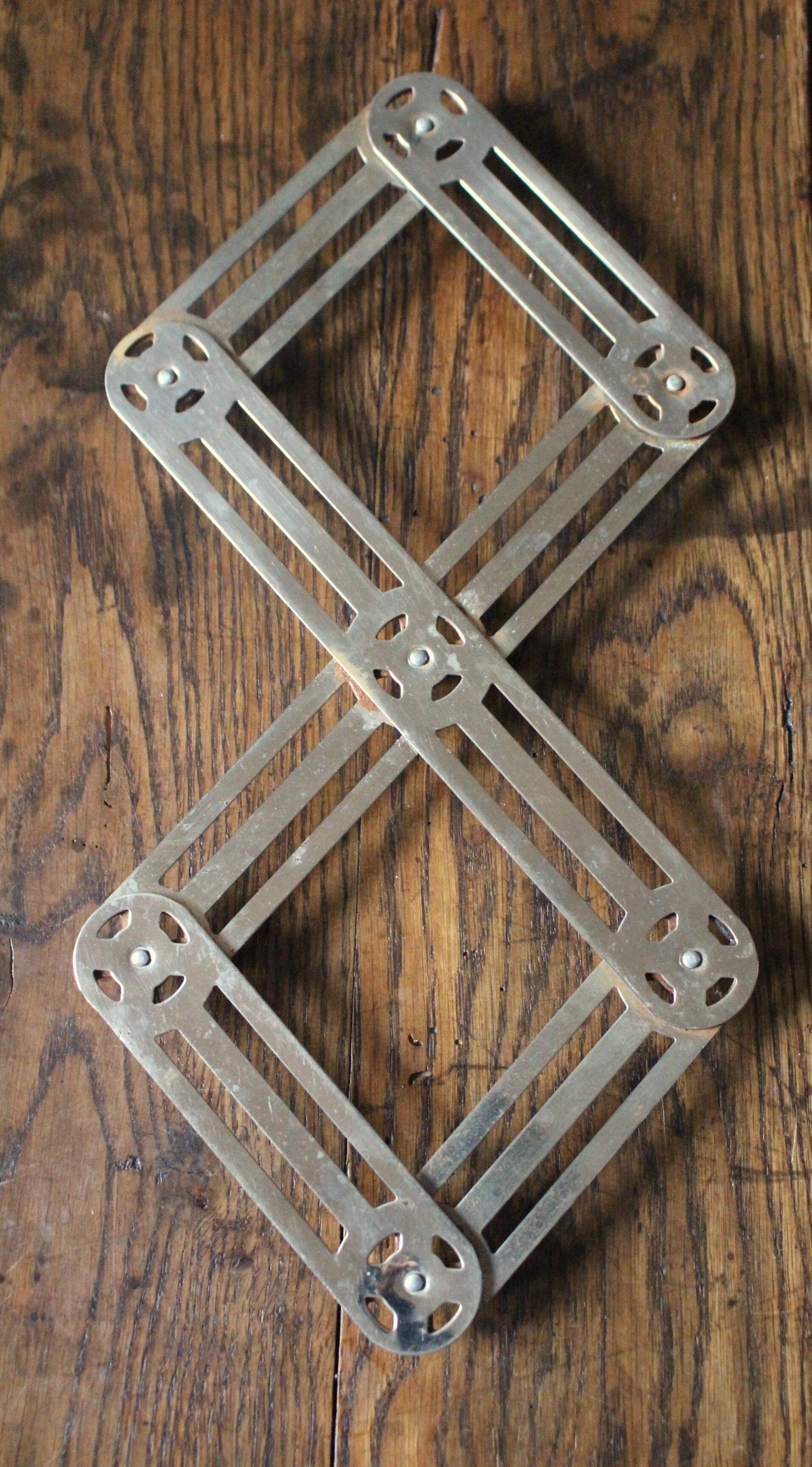 Vintage folding metal trivet