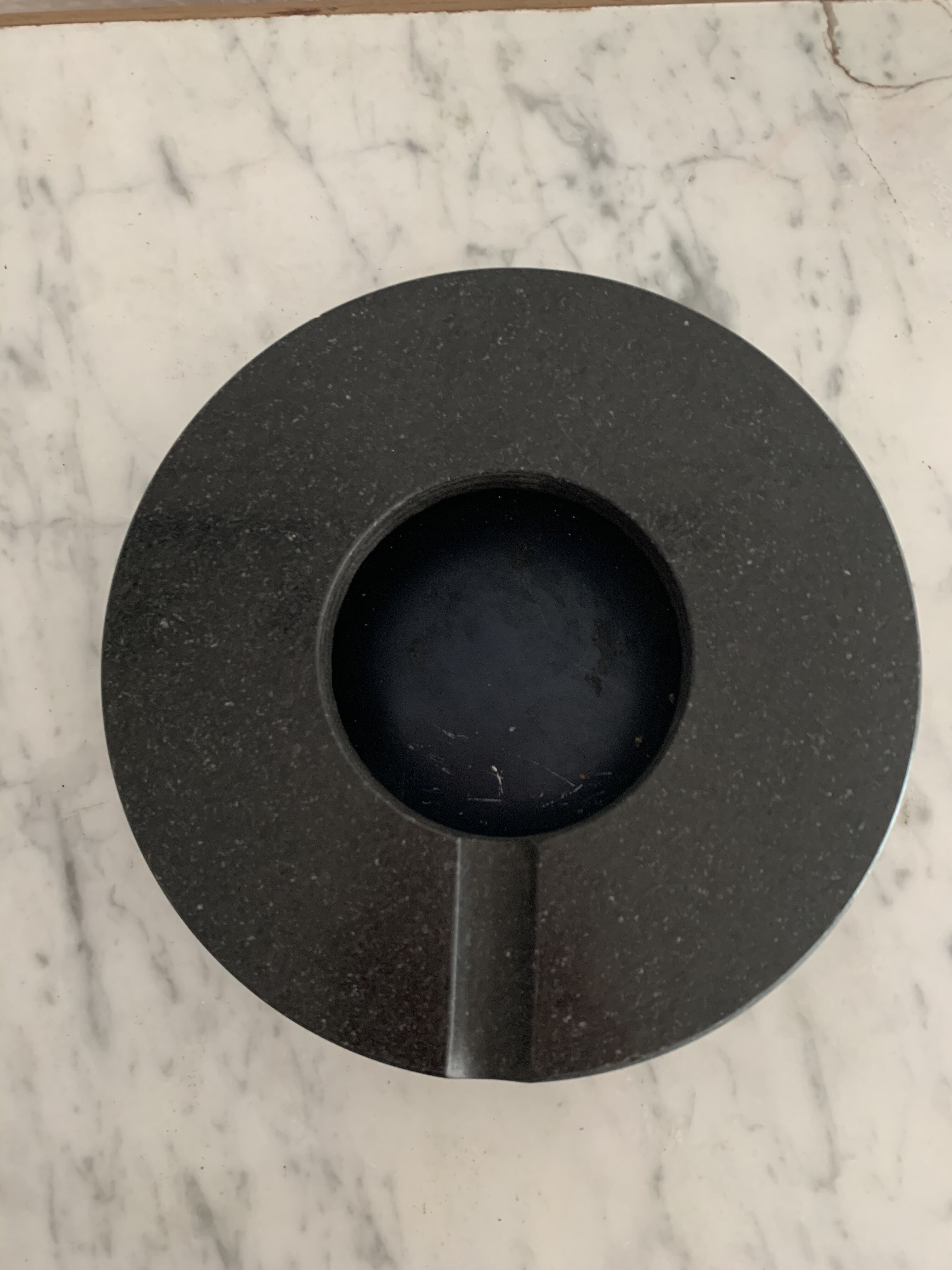 Grey-grey and black speckled marble round ashtray