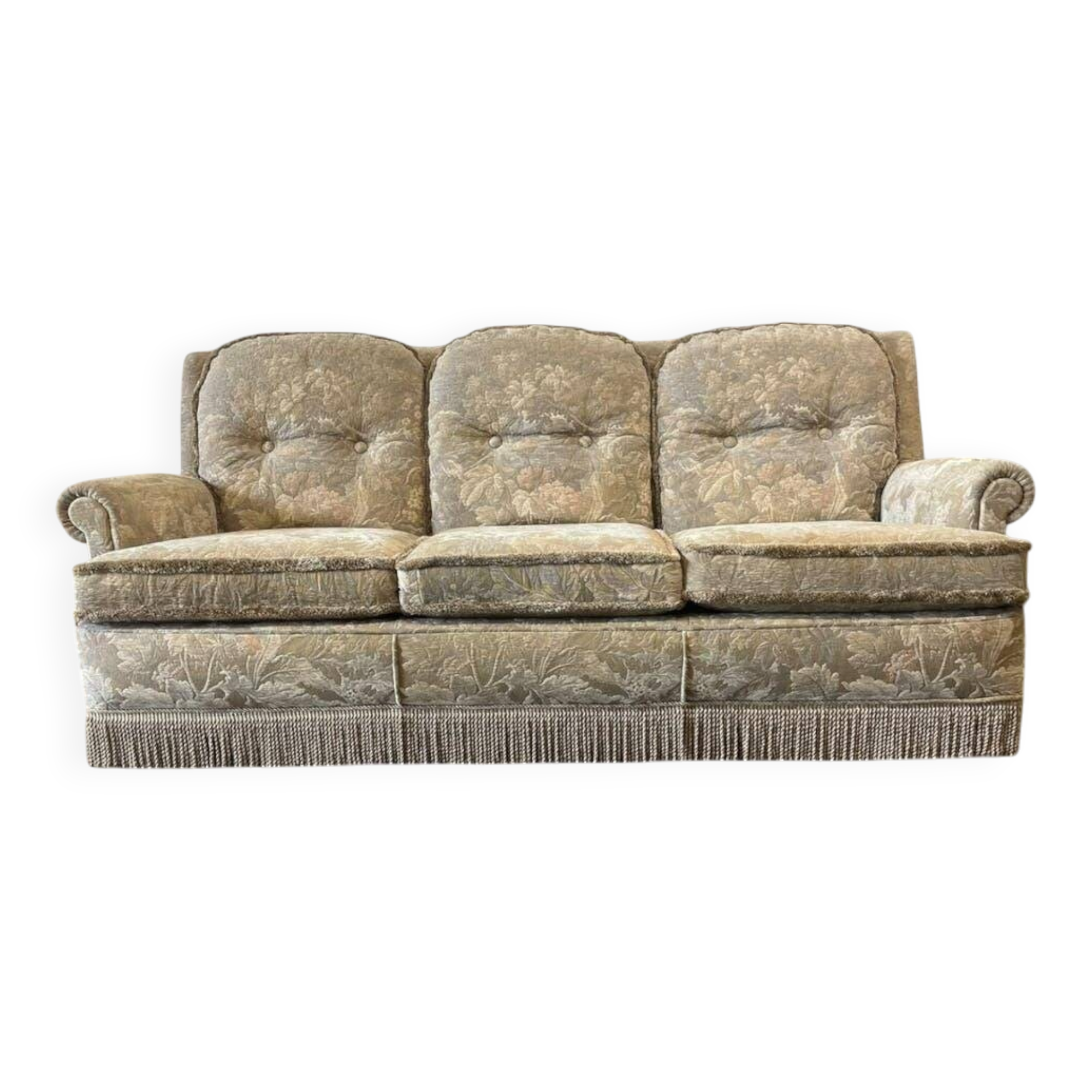 Vintage beige three-seater sofa with floral pattern and fringes.