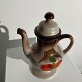 Vintage stoneware teapot with flower and fruit patterns