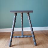 Bluish-grey tripod stool
