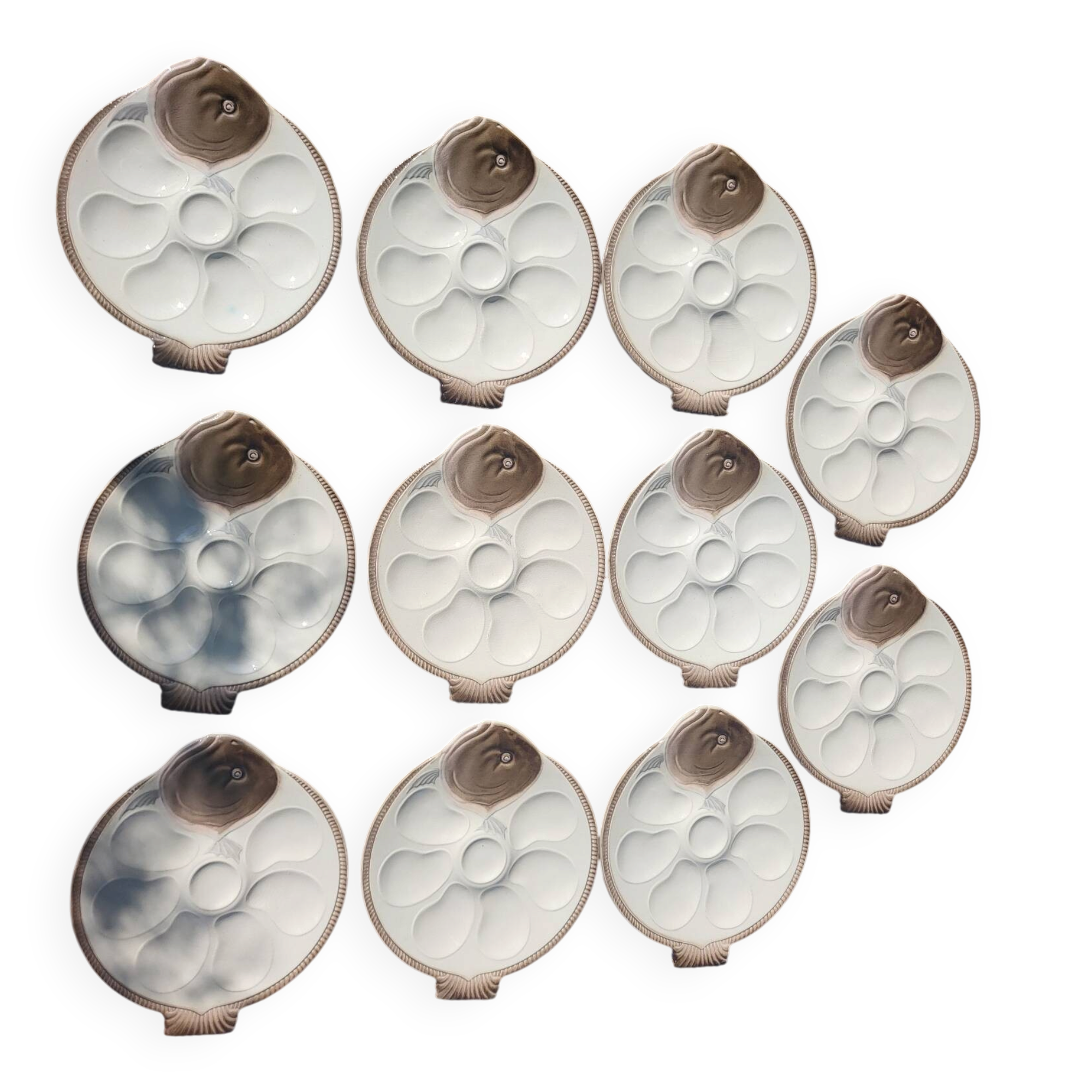 11 Longwy oyster plates with wells and a central compartment.
