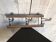 Antique wall coat rack in brown wood and iron, circa 1900, with folding hooks.