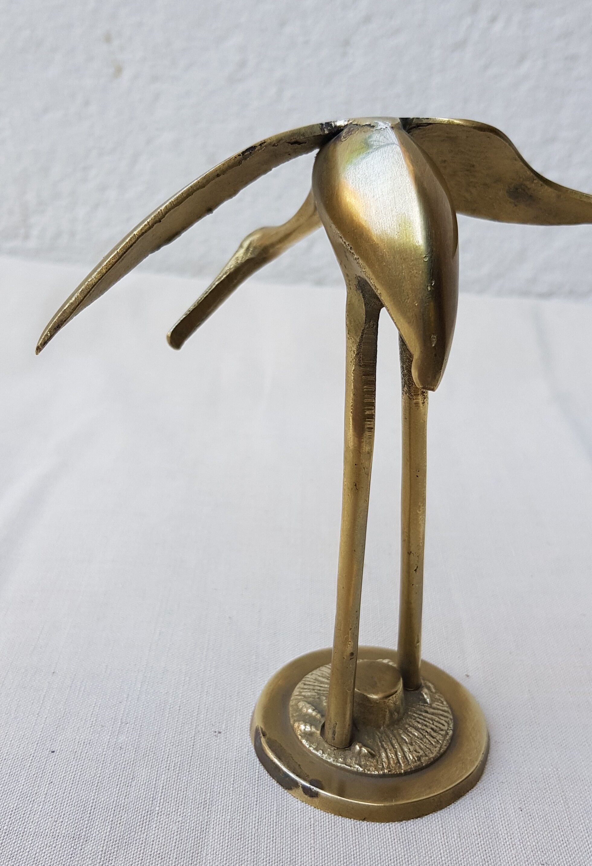 Small brass heron