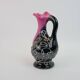 Black and pink Vallauris carafe with white relief patterns