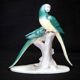 Earthenware figurine, a pair of German porcelain parrots