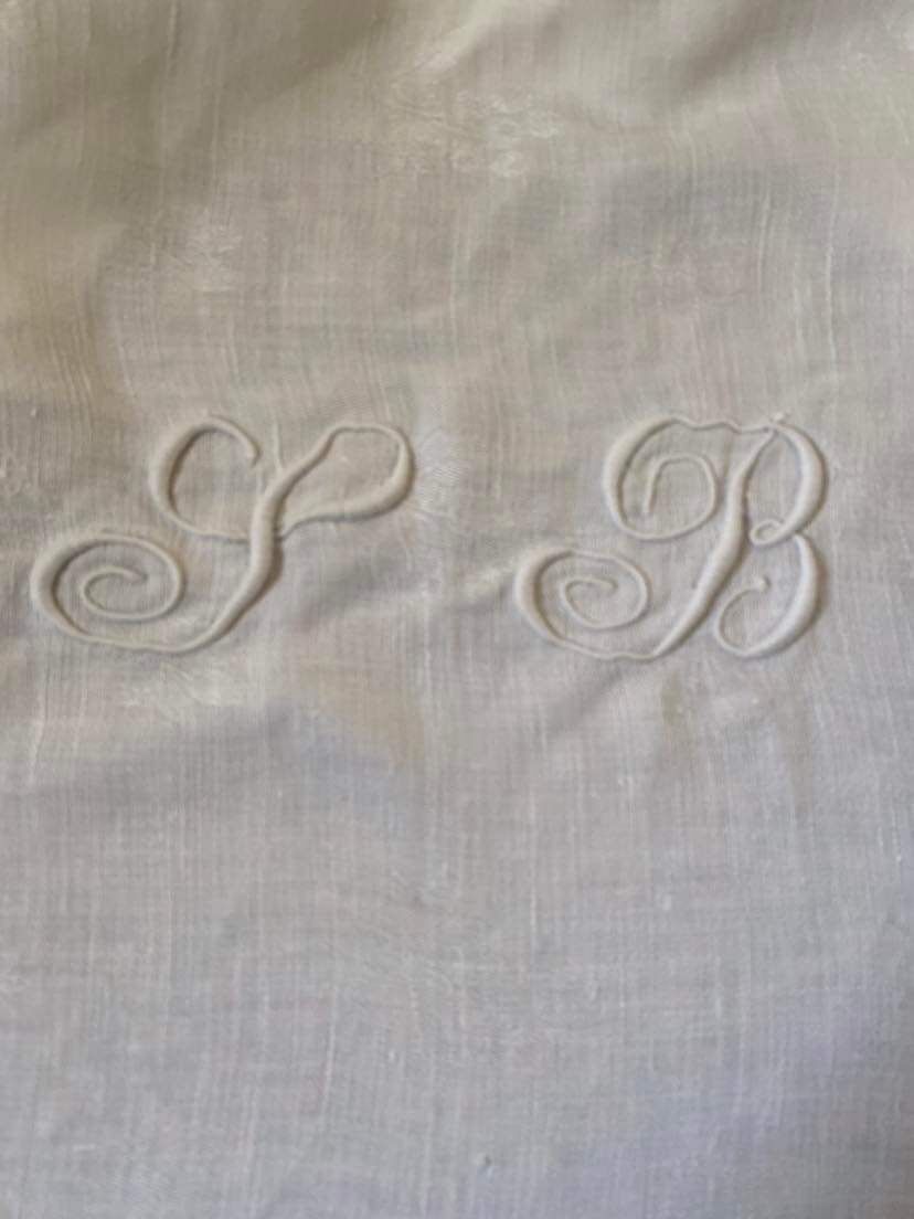 Old tablecloth in white cotton and monogram