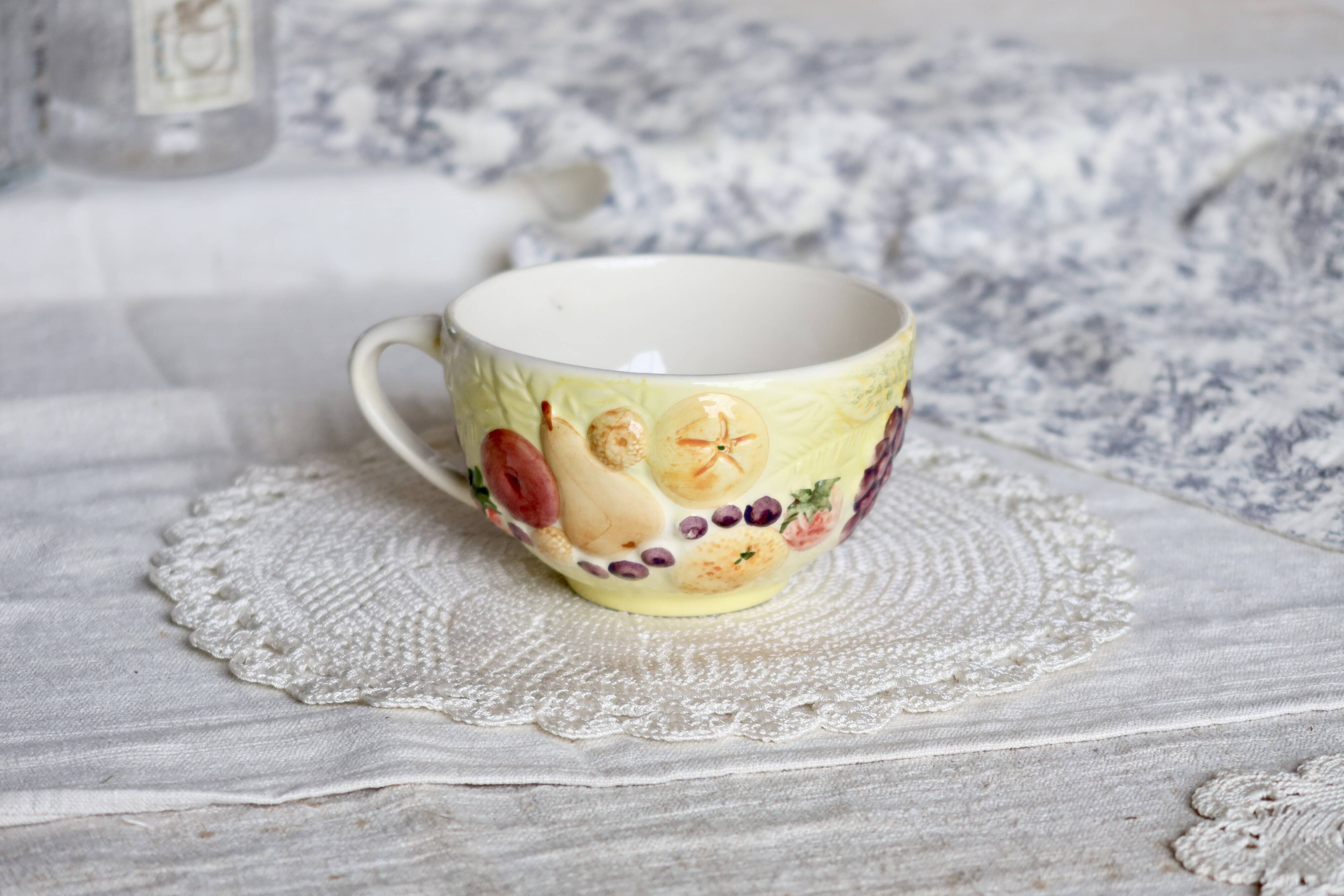 Large vintage earthenware mug with fruit motif and slip details
