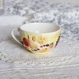 Large vintage earthenware mug with fruit motif and slip details