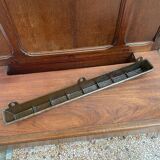 Antique wooden coat rack with mirror and shelf.