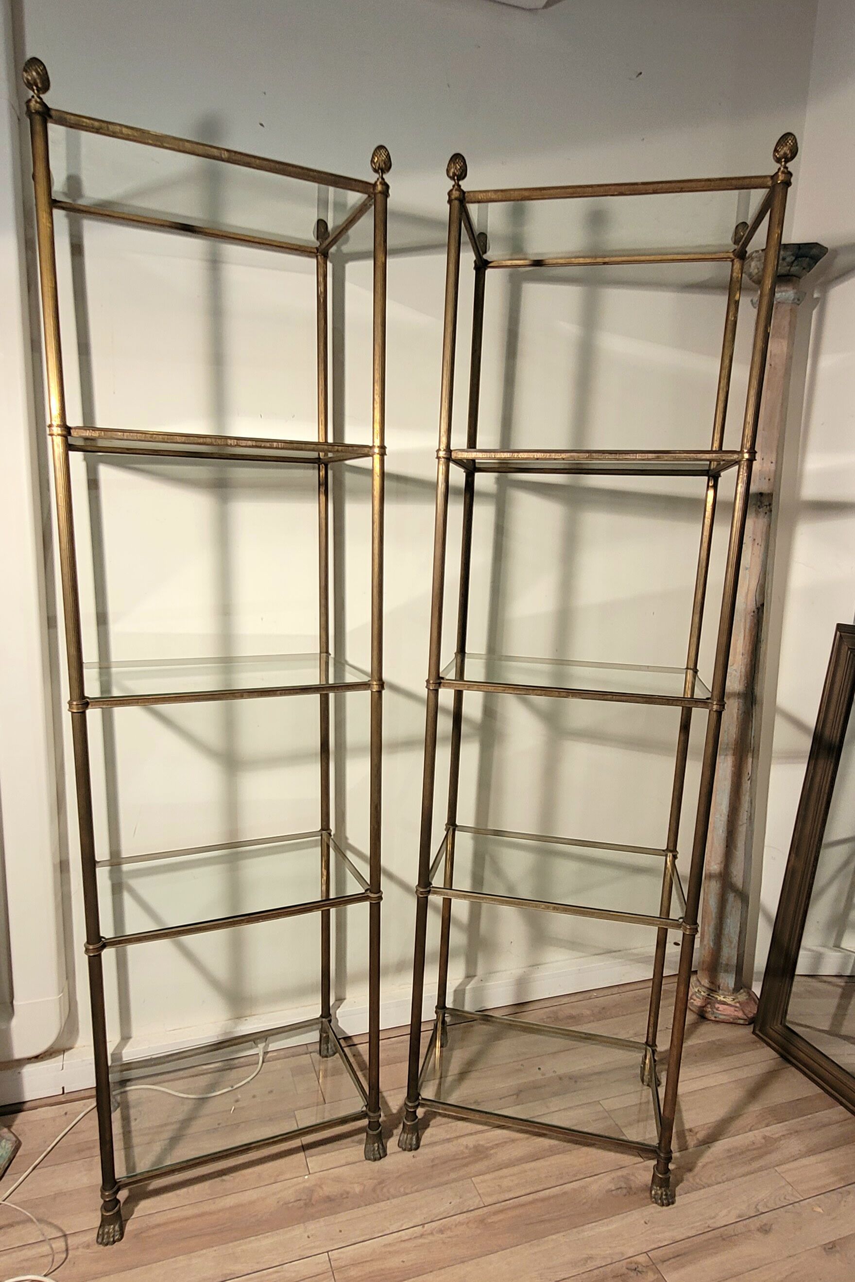 Pair of brass and gilded bronze shelves feet lion's feet