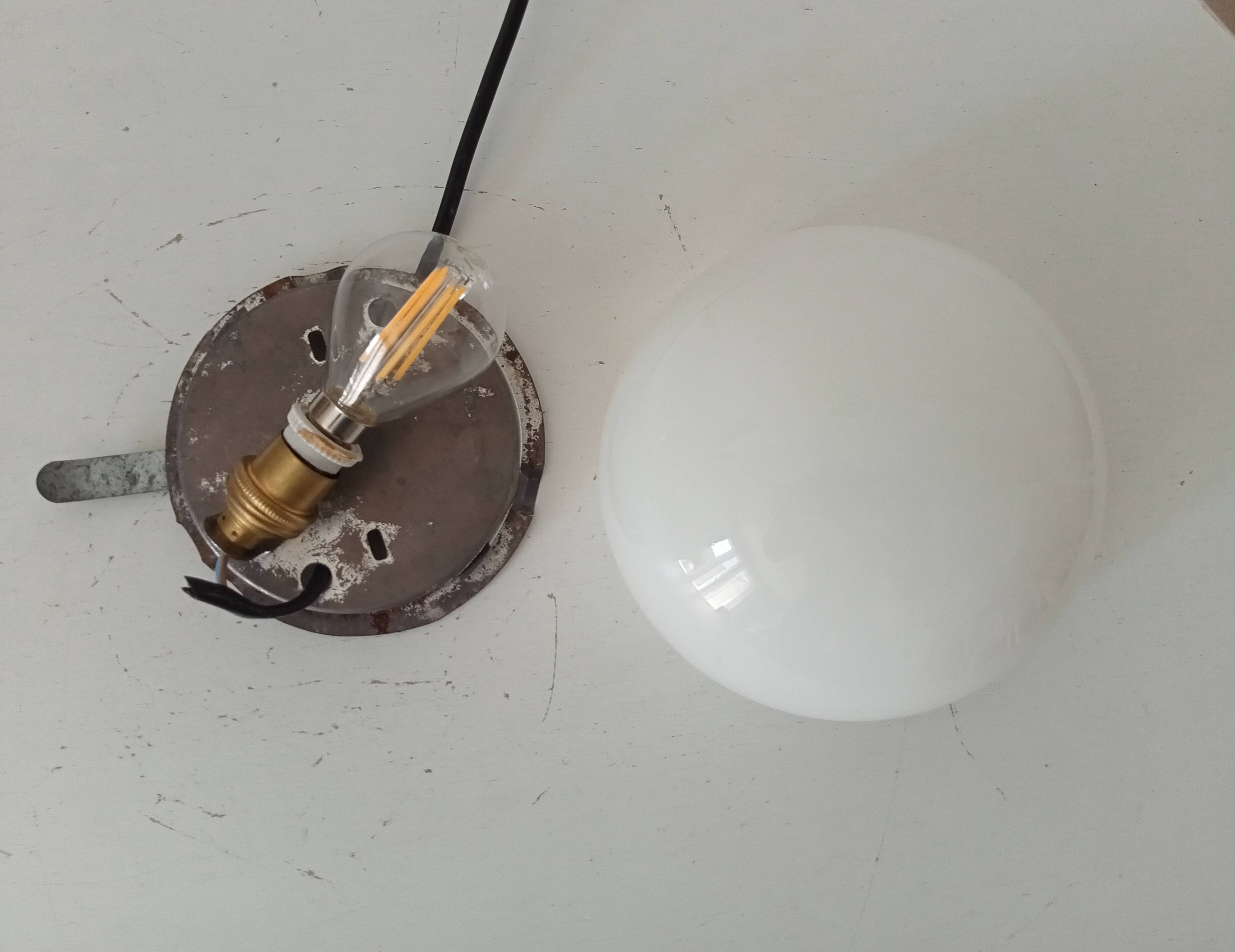 Vintage opaline wall light from the 1960s.