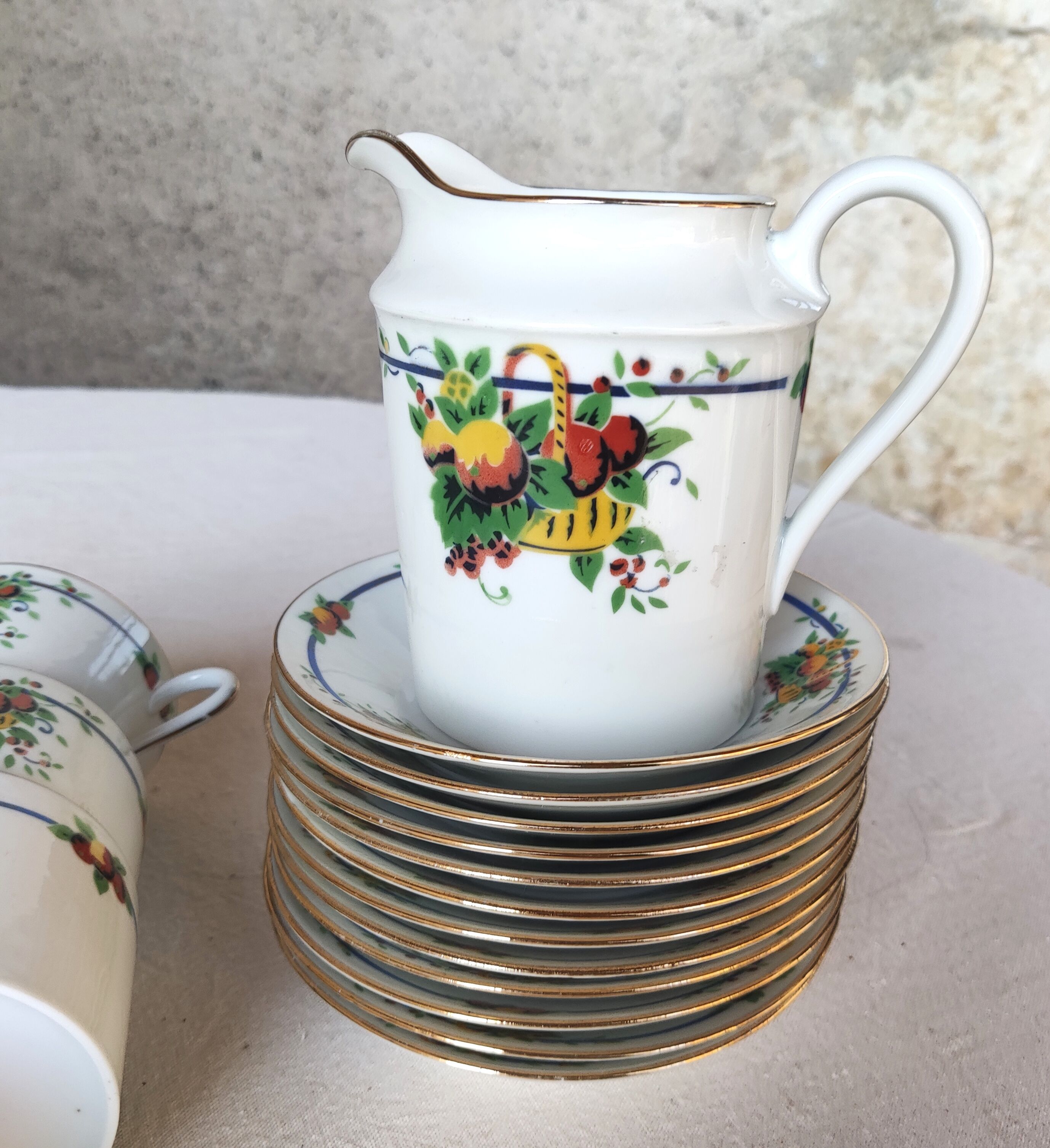 10 tea cups and creamer in Limoges porcelain