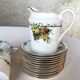 10 tea cups and creamer in Limoges porcelain