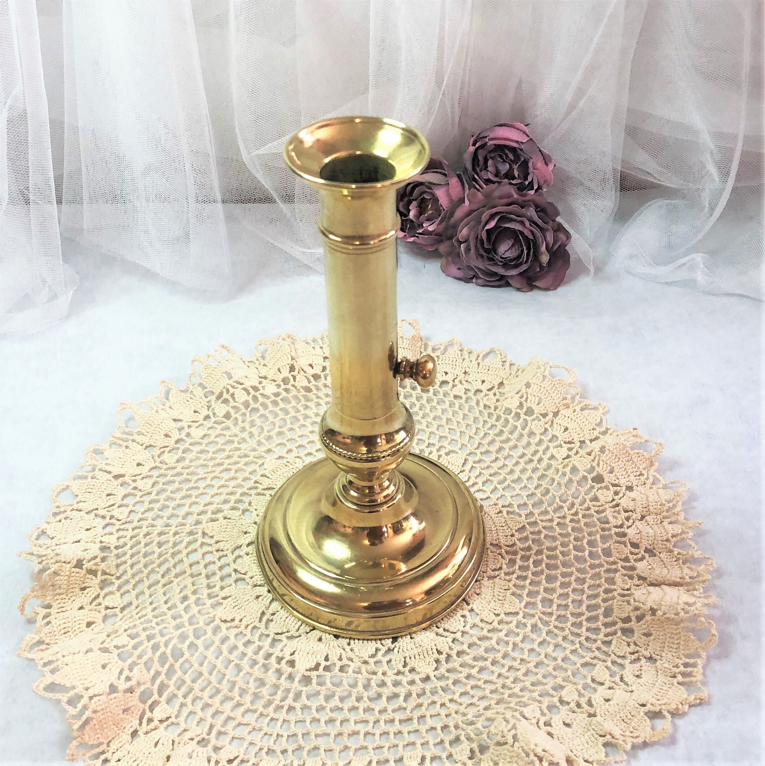 Gilded copper push candle holder