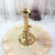 Gilded copper push candle holder