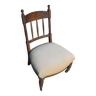 Ancienne chaise basse de nourrice en bois sculpté