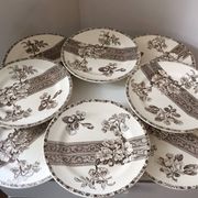 8 Terre de Fer dessert plates, 19th century