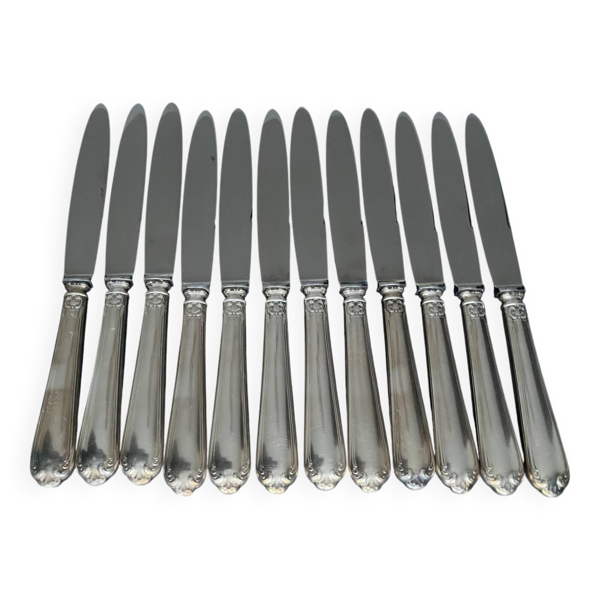 12 silver metal knives