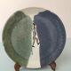 Glazed ceramic plate representation man between two lands unknown signature