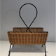 Rattan and black lacquered metal magazine rack