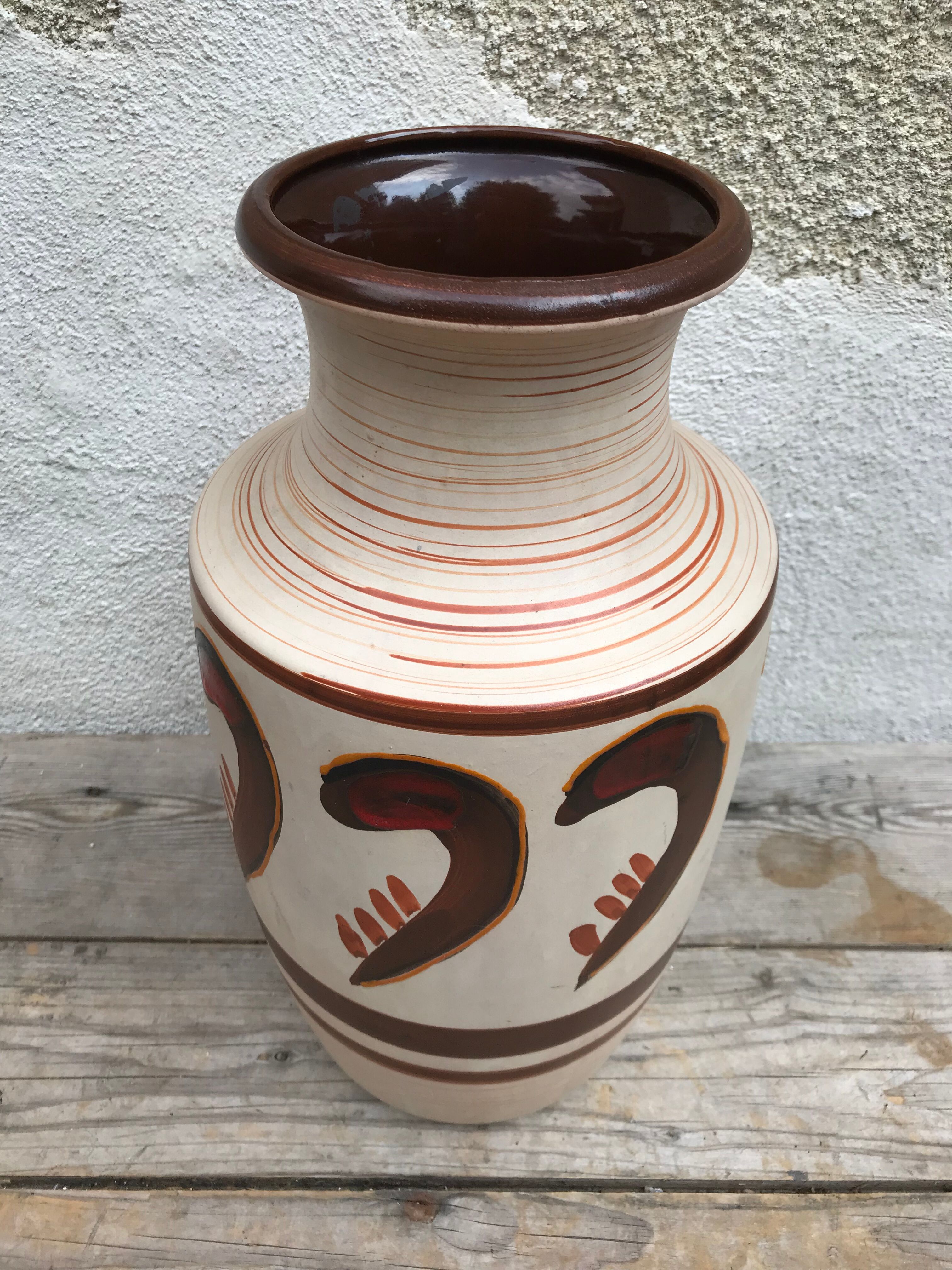 Antique beige ceramic vase with decorative painting