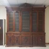 Glass-fronted walnut bookcase