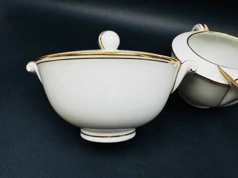 Limoges porcelain A. Vignaud sugar bowl and milk jug with gold trim
