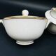 Limoges porcelain A. Vignaud sugar bowl and milk jug with gold trim