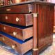 Commodity with mahogany detached columns and Empire gilded bronze ornaments