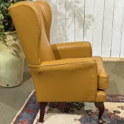 Pair of 1980s English wingback armchairs in leather.