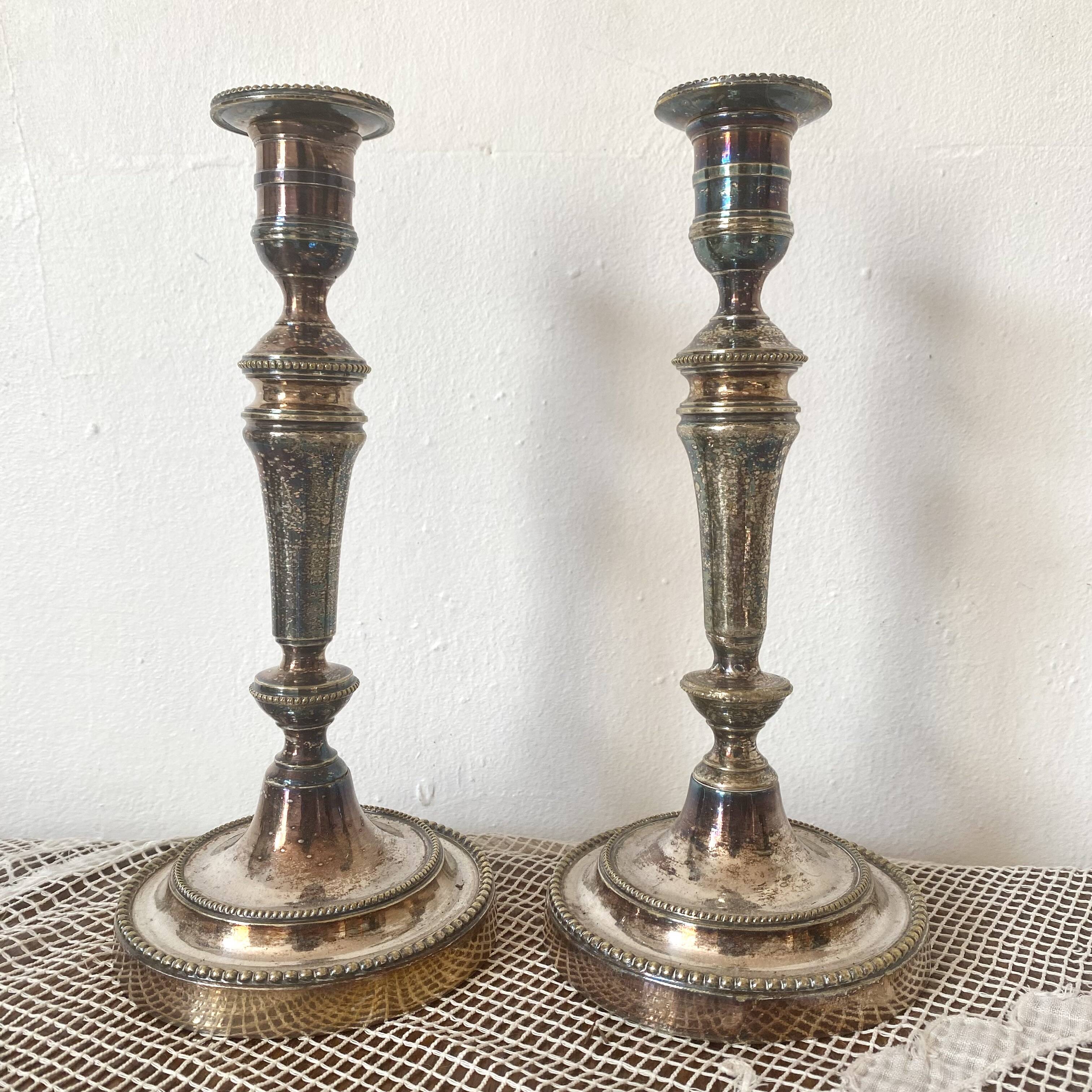 Pair of silver-plated metal candlesticks