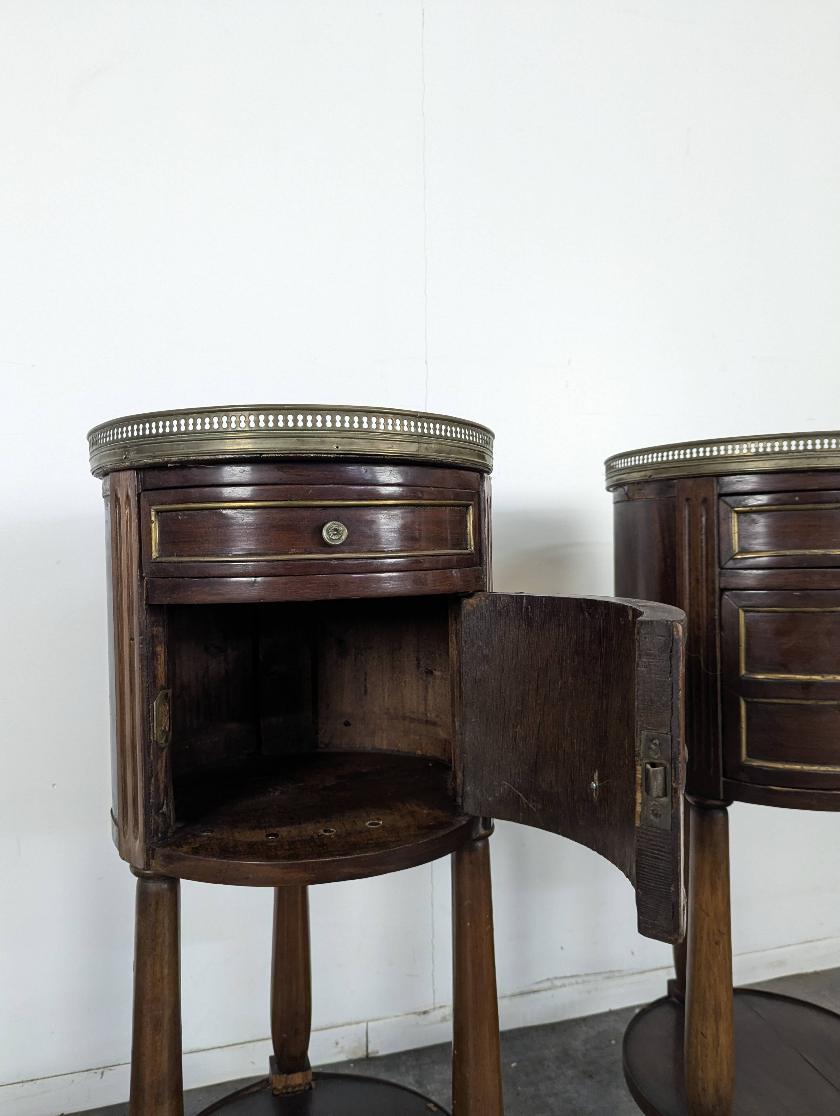 Pair of Louis XVI style bedside tables with a gallery.