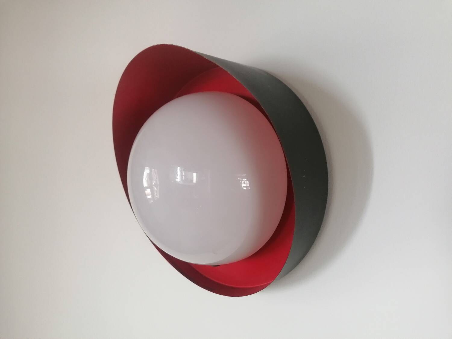 Metal wall light with glass globe
