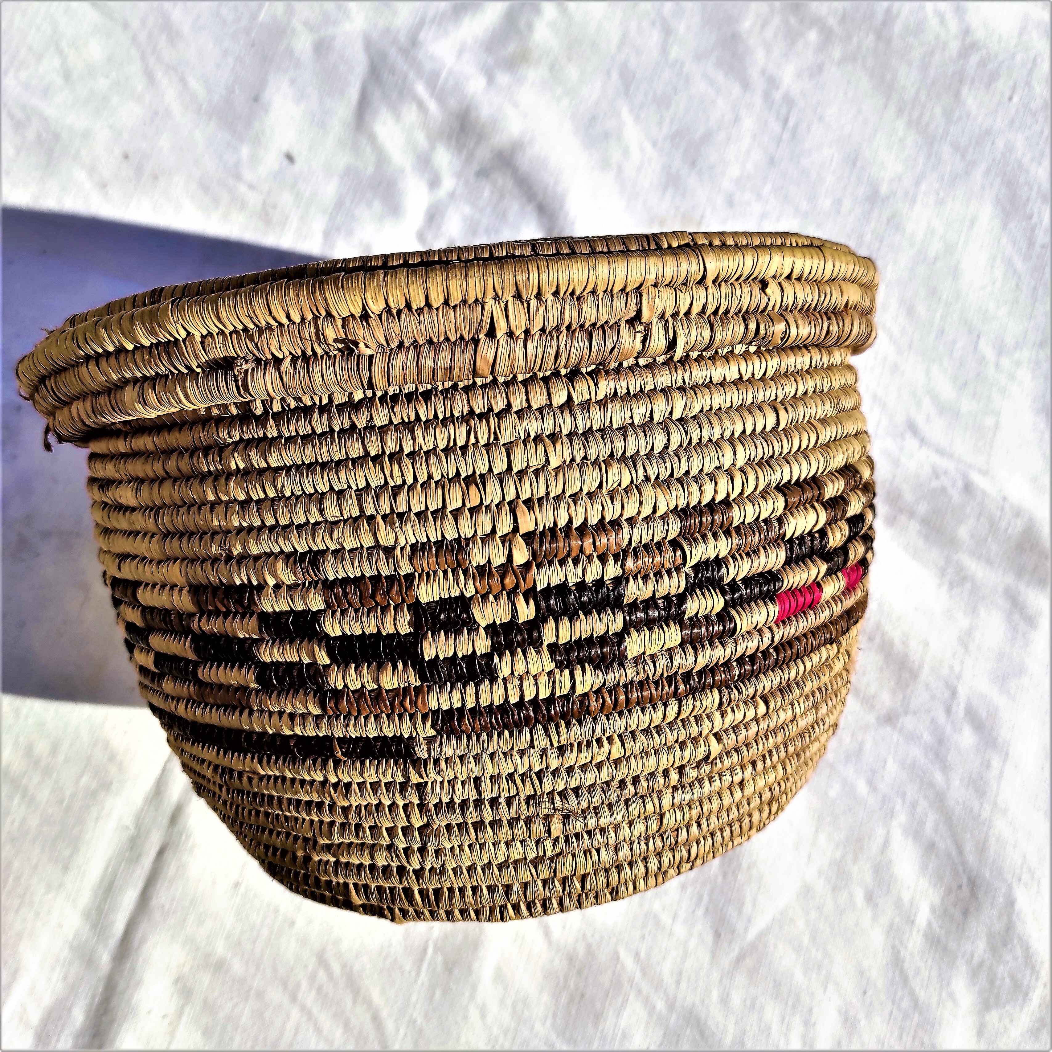 Antique basket with ethnic lid with black/brown and red décor