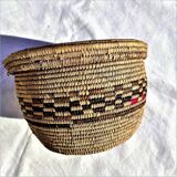 Antique basket with ethnic lid with black/brown and red décor
