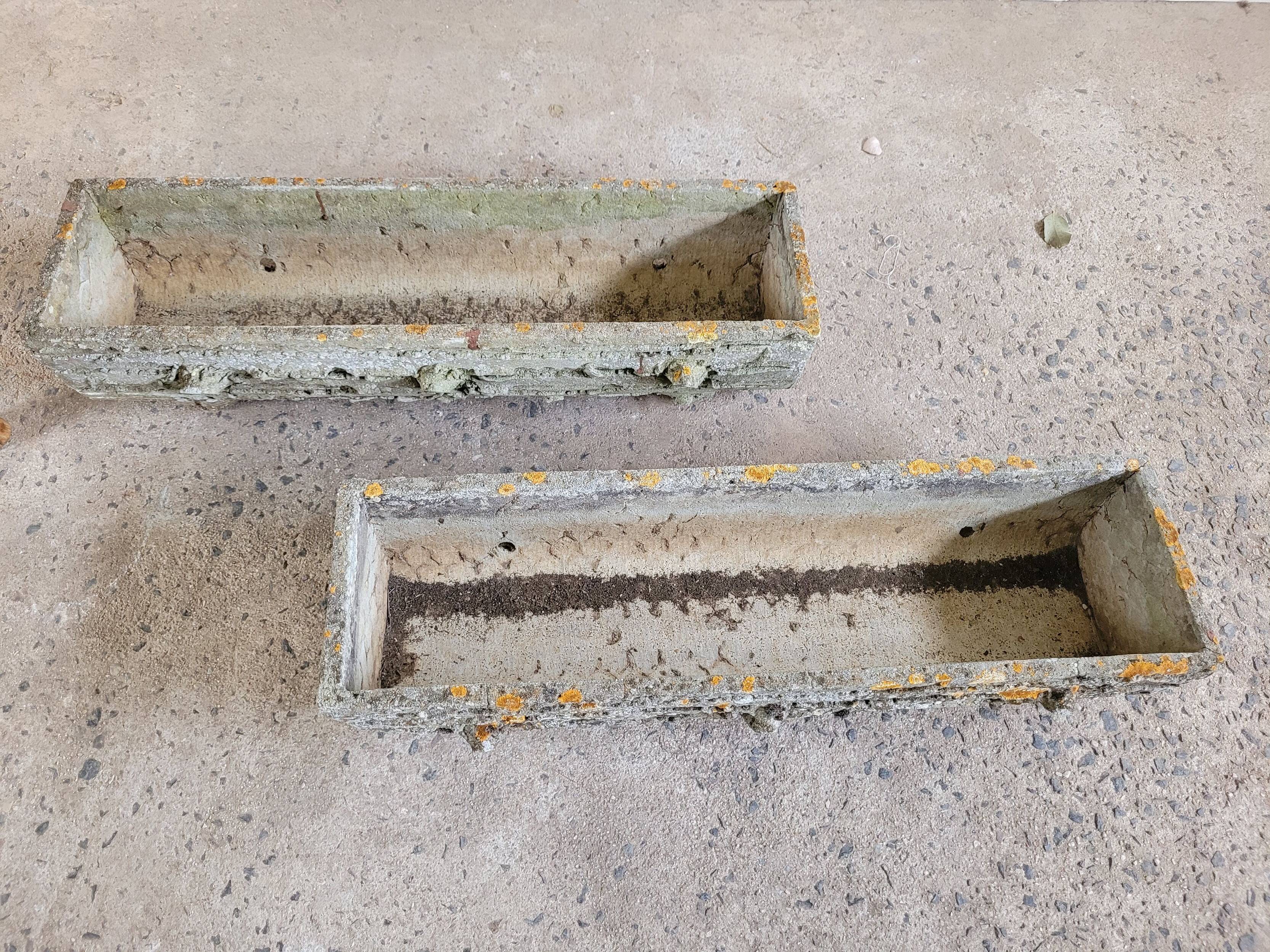 Old planters in faux cement wood