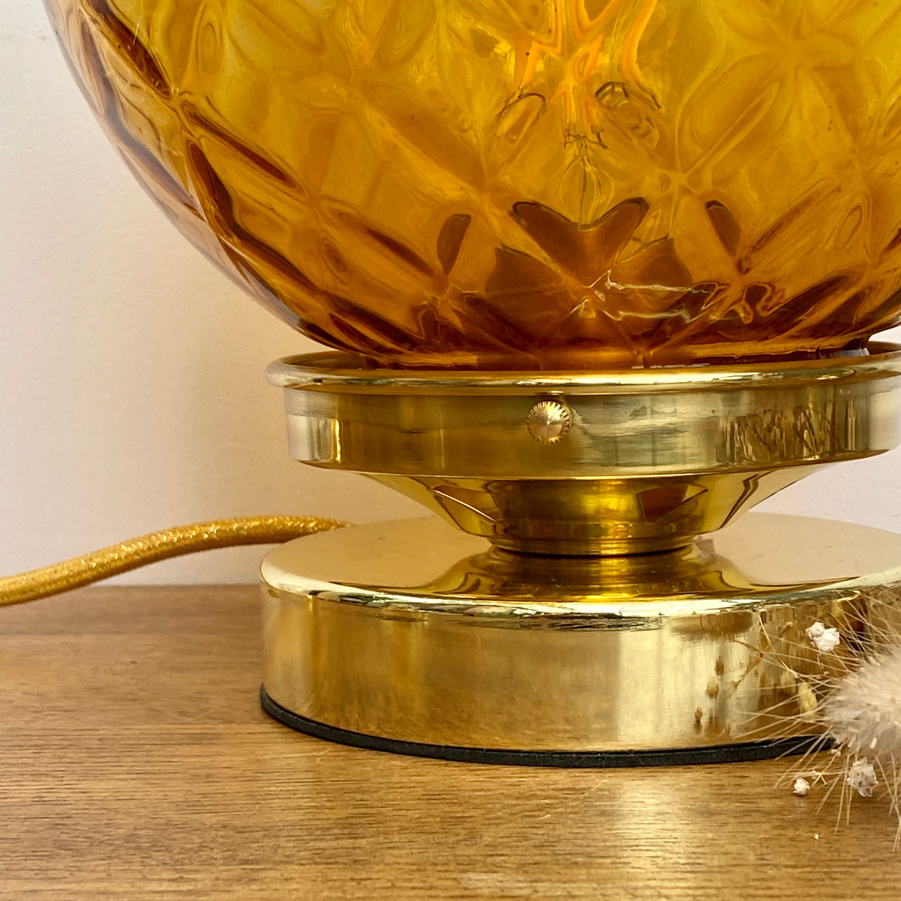 Vintage amber glass globe laying lamp with brass detail