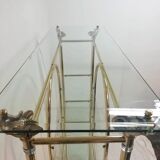Hollywood Regency brass and glass shelf with elephant heads from the 1970s