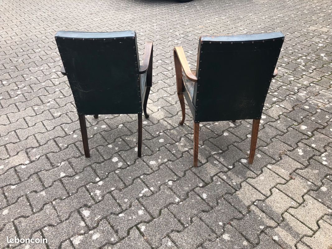 2 Dark green vintage wood and leather armchairs