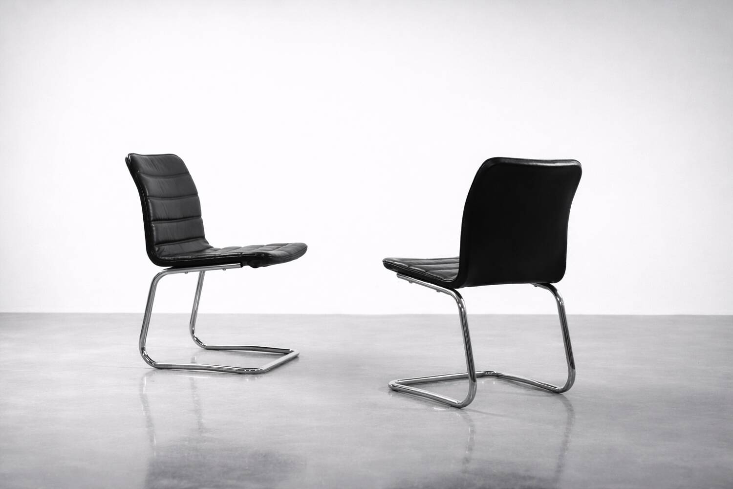 Vintage Mid-Century Minimalist Chrome and Black Leather Club Chairs