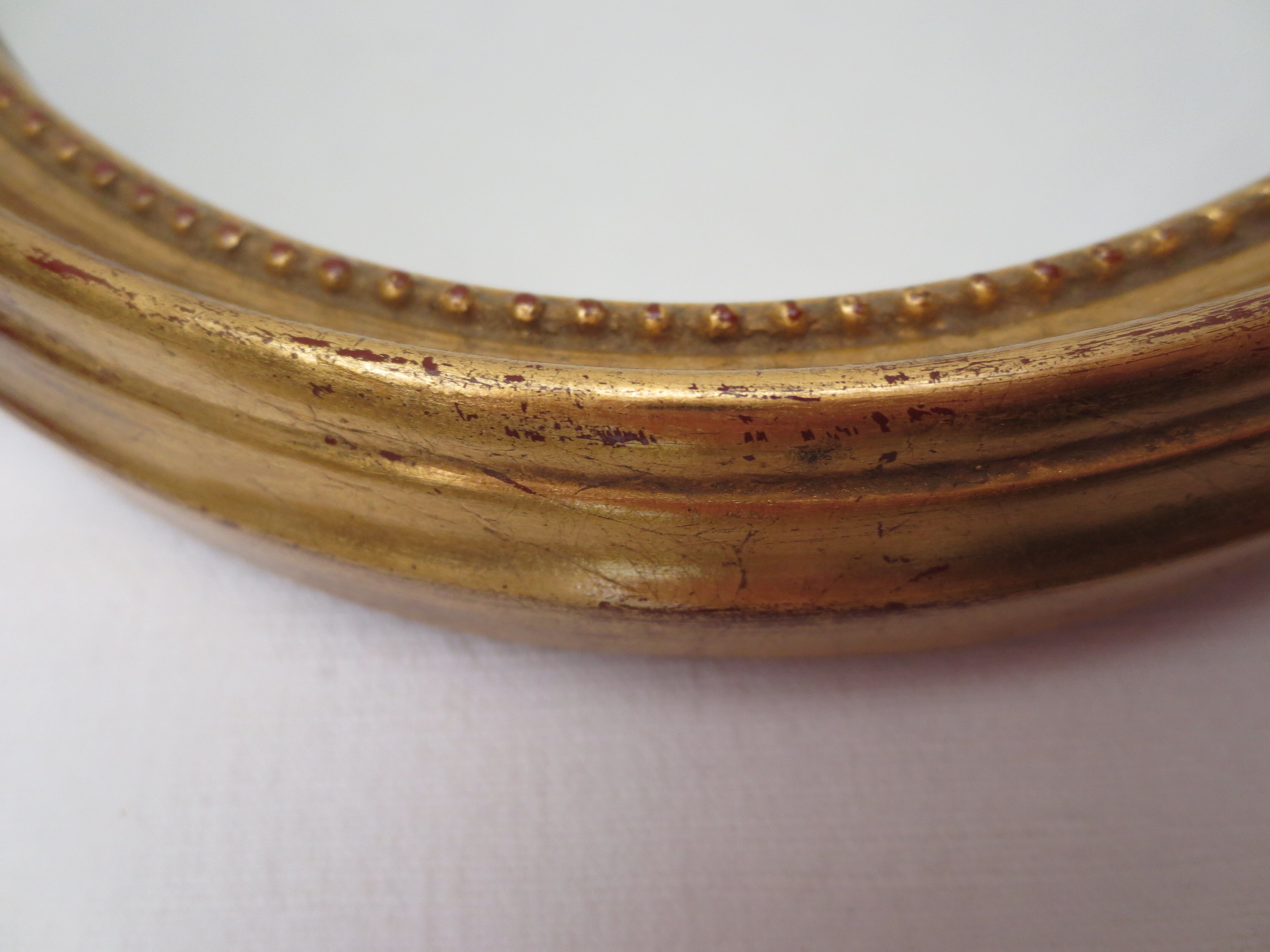 Oval wooden mirror gilded tower, medallion type