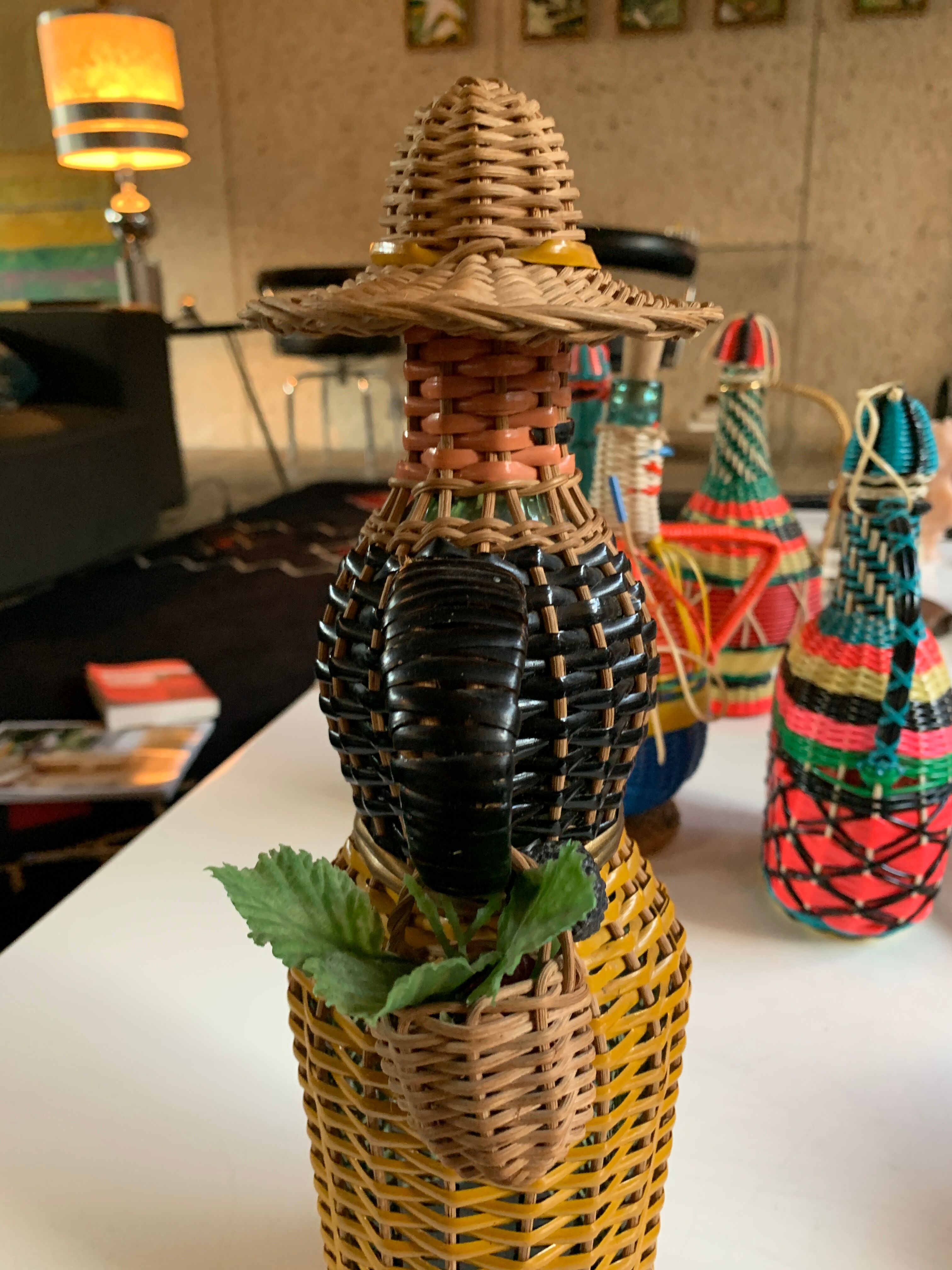 Braided bottle in anthropomorphic wicker