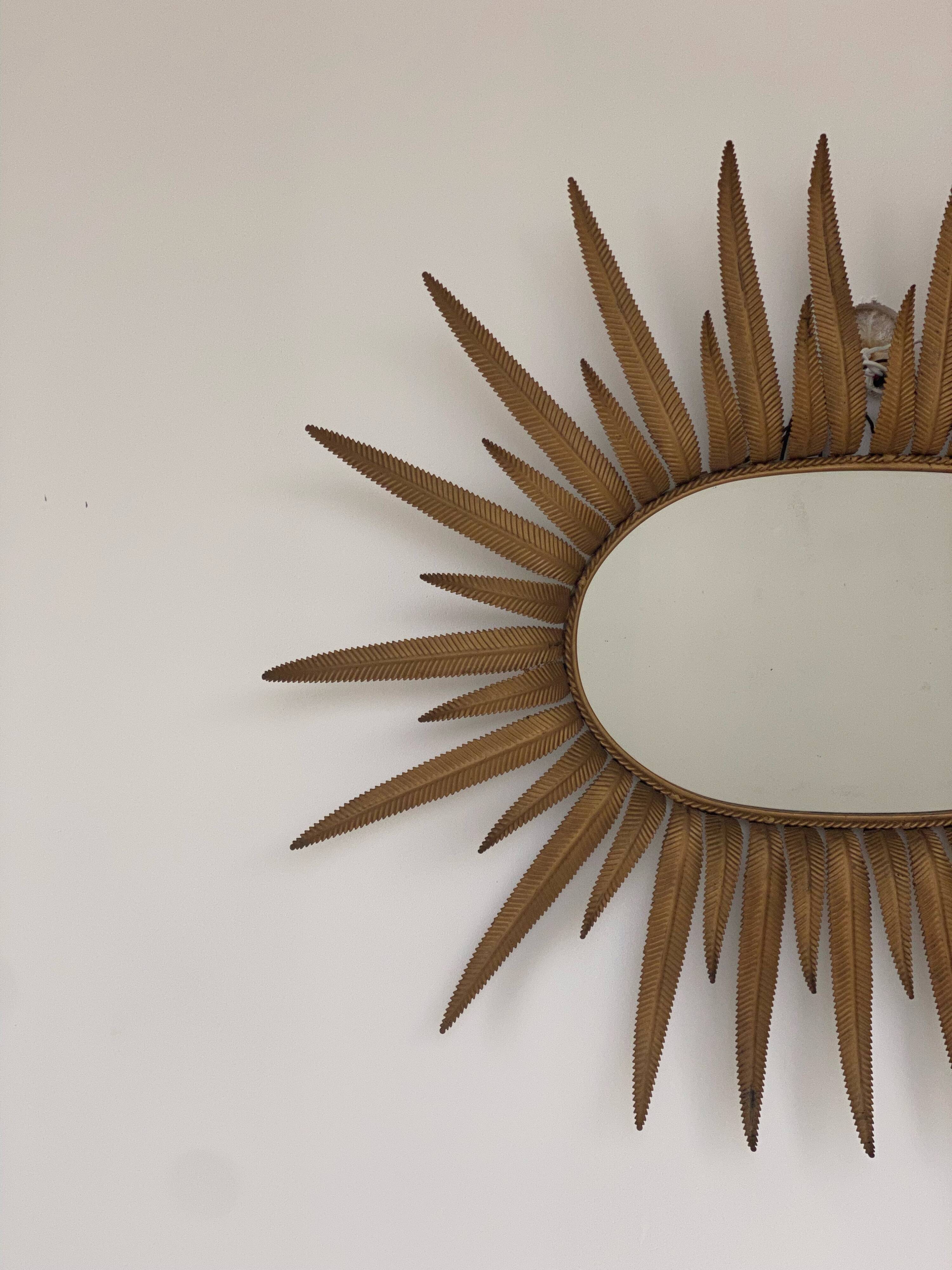 Vintage copper metal sun mirror oval shaped from the 1960s