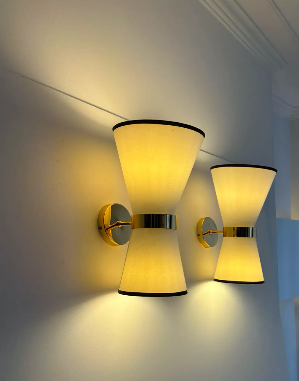Pair of vintage wall lamps, solid brass and unbleached fabric, Italy 1980