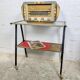 Vintage 1950s rolling dessert trolley with two shelves.